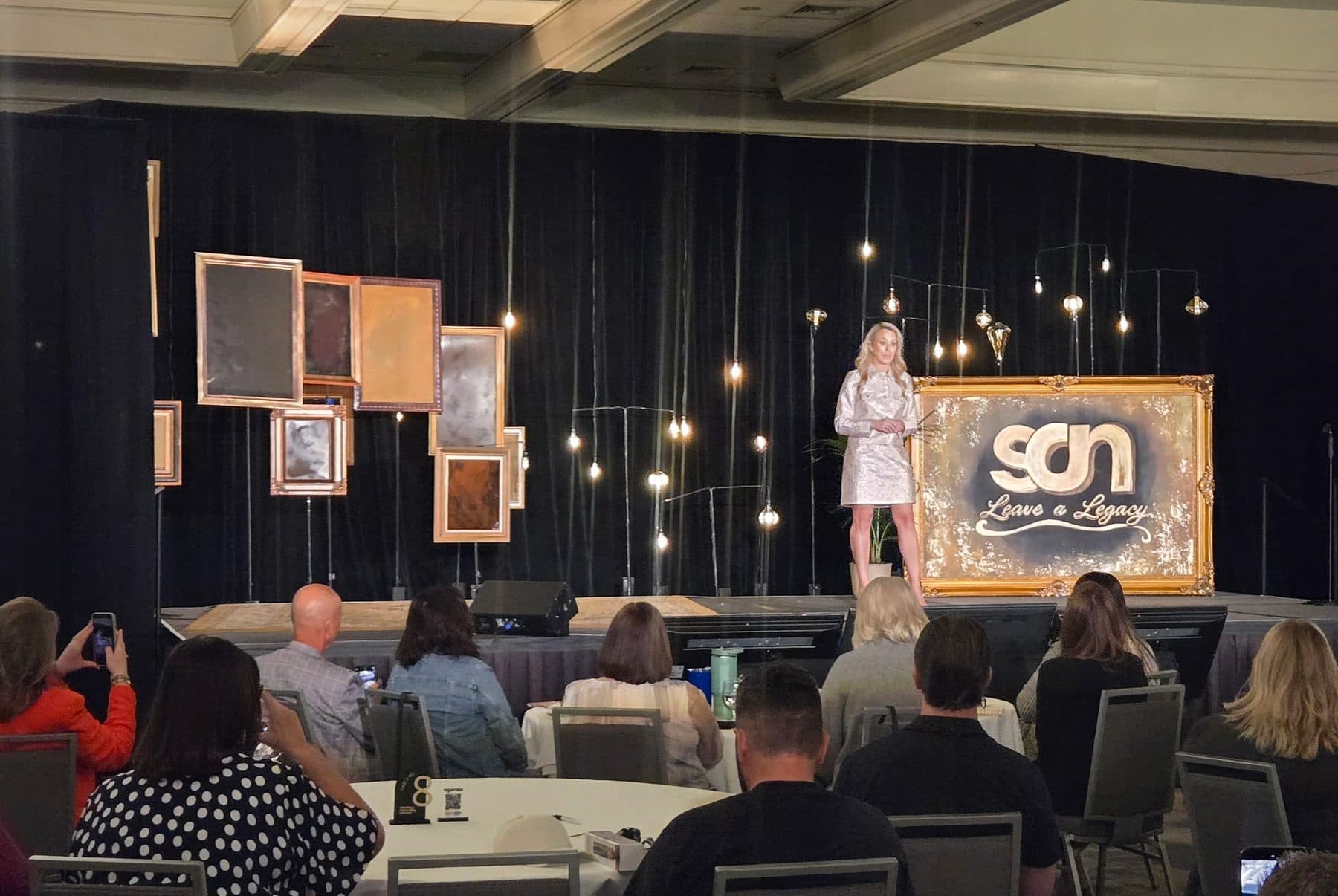 Marni Blythe on stage speaking to a leadership audience